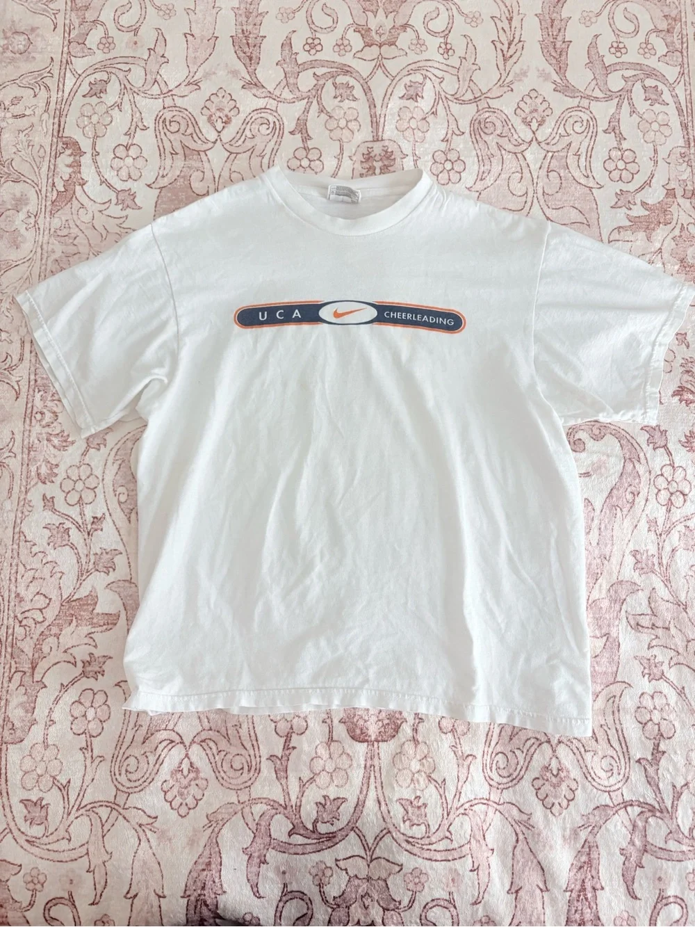 Nike White UCA Cheerleading Short Sleeve Tee with Navy and Orange Logo
